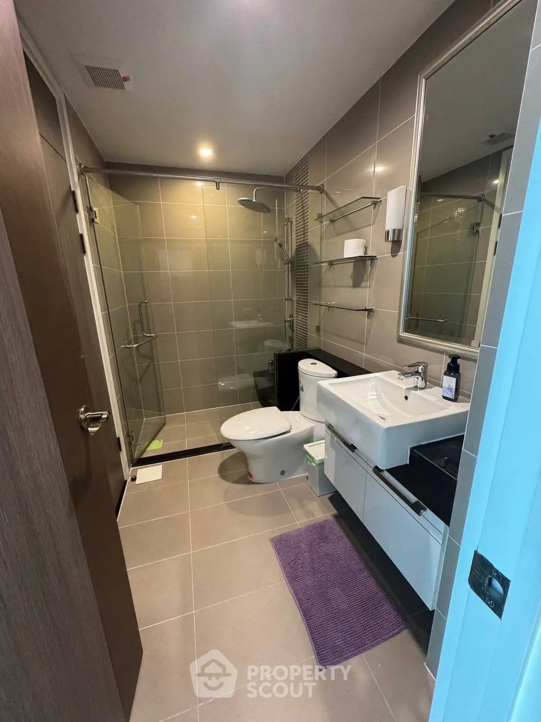 Modern bathroom with sleek fixtures and glass shower enclosure