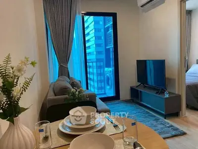 Modern living room with balcony view and stylish decor in urban apartment