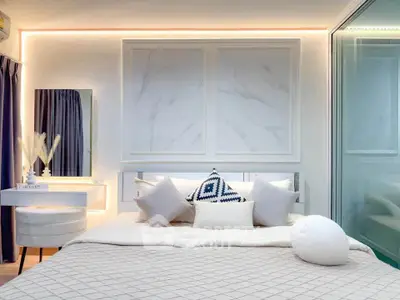 Luxurious modern bedroom with elegant decor and ambient lighting
