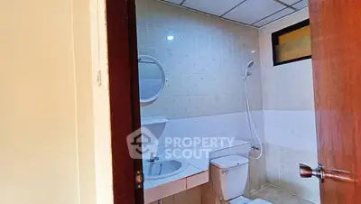Cozy bathroom with modern fixtures and tiled walls