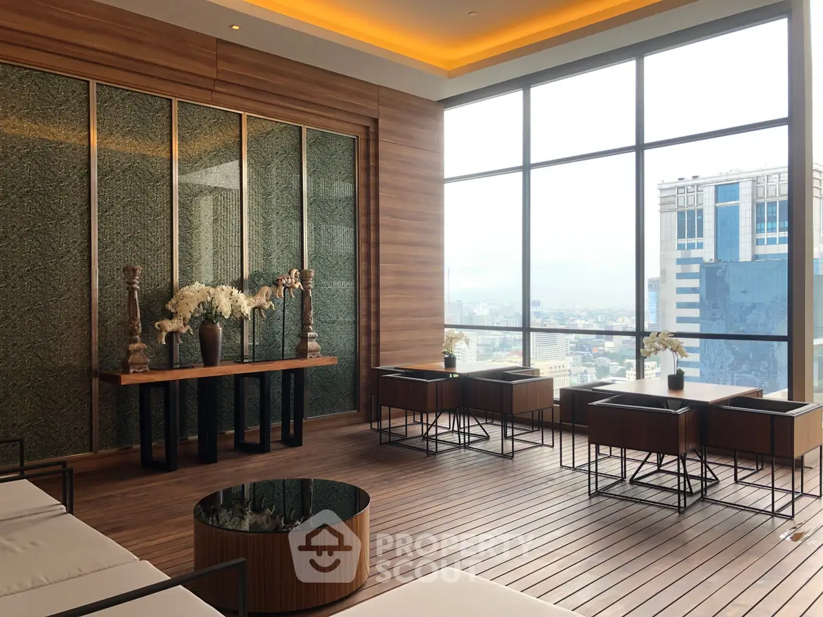 Luxurious high-rise building lounge with panoramic city views and elegant wooden decor.
