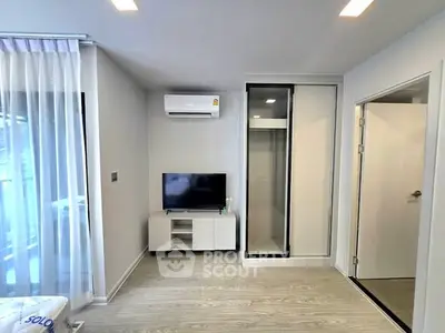 Modern living room with sleek design and air conditioning unit