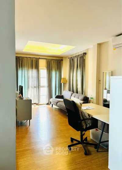 Spacious living room with modern decor and natural light