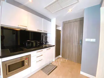 Modern kitchen with sleek appliances and stylish cabinetry