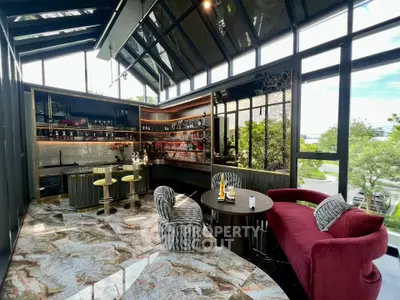 Luxurious modern living room with stylish bar and panoramic windows