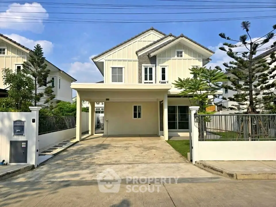 Charming two-story house with spacious driveway and modern design in a serene neighborhood.