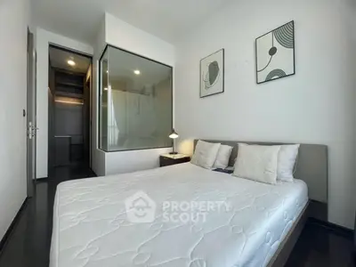 Modern bedroom with glass partition and minimalist decor