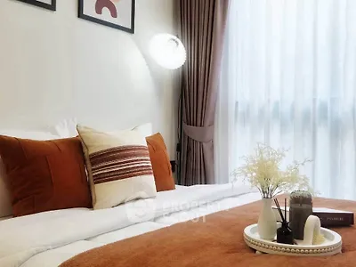 Cozy bedroom with stylish decor and natural light