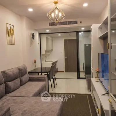 Modern living room with stylish decor and open kitchen layout