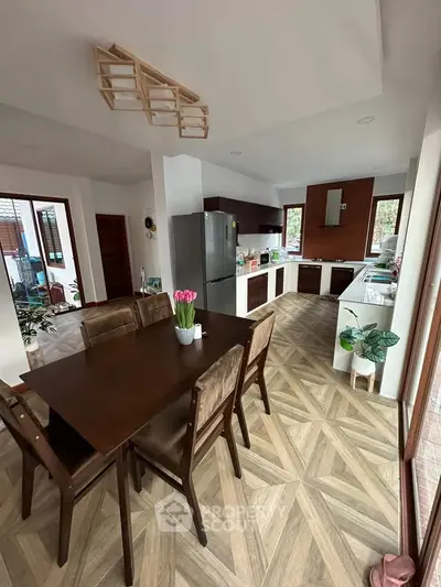 Spacious modern kitchen with dining area and stylish wooden flooring