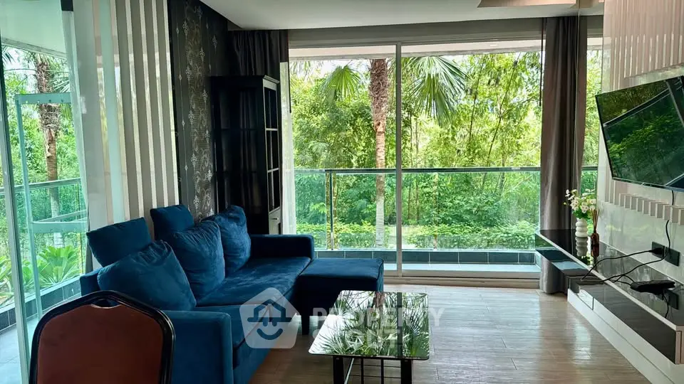 Luxurious living room with floor-to-ceiling windows and lush garden view