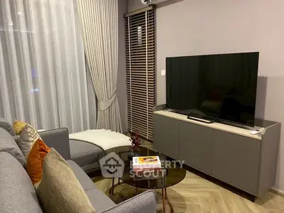 Cozy living room with modern decor and large TV setup