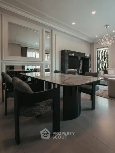 Luxurious modern dining area with elegant marble table and plush seating
