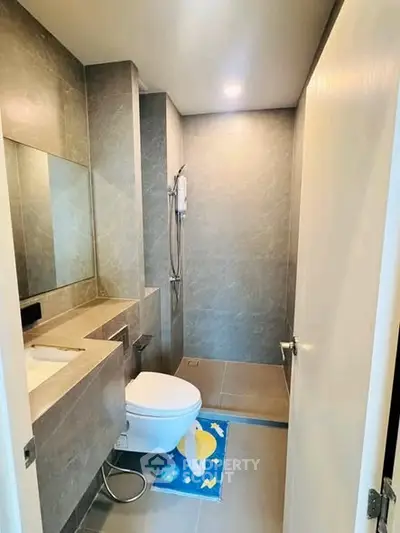 Modern bathroom with sleek design and spacious shower area