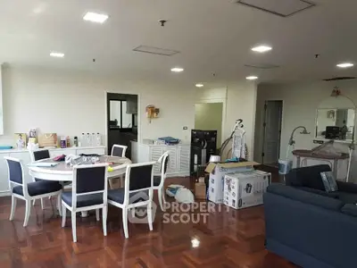 Spacious living room with dining area and hardwood floors