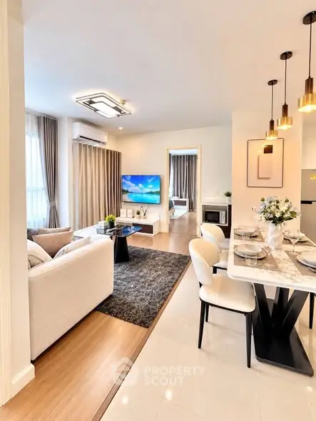 Modern open-plan living room with elegant dining area and stylish decor