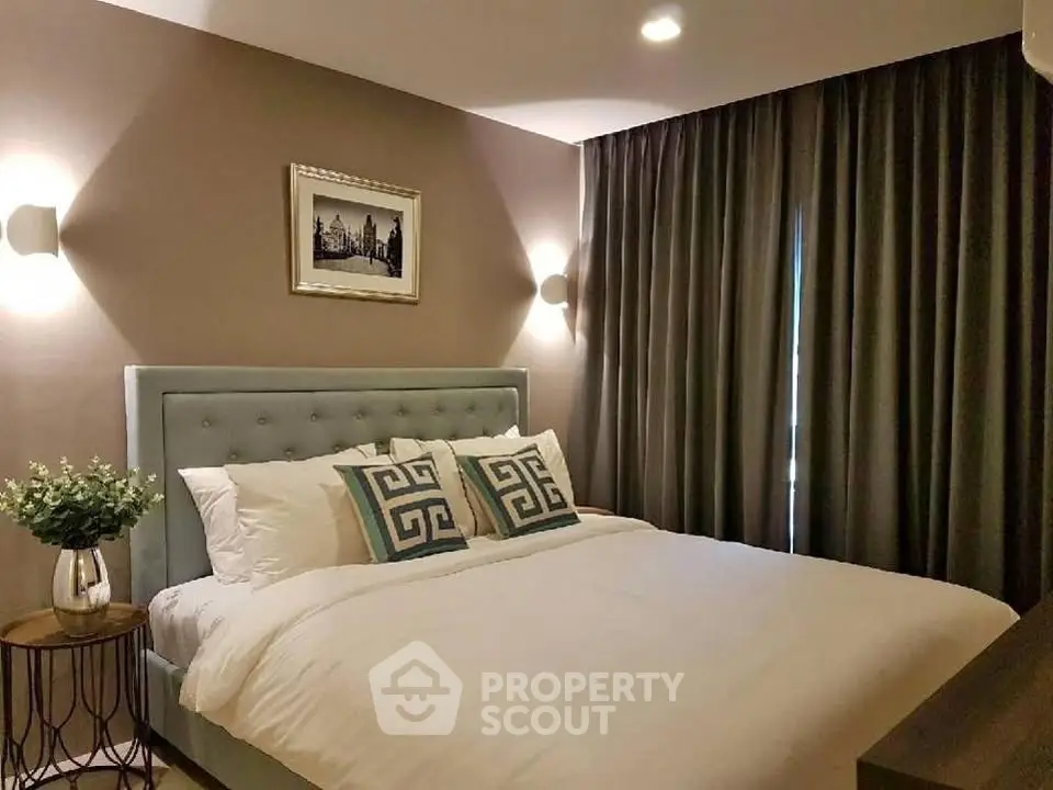 Elegant bedroom with plush bed, stylish decor, and soft lighting for a cozy ambiance.