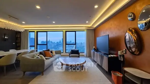 Luxurious living room with stunning city view, modern decor, and elegant lighting.