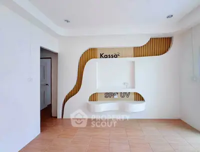 Modern interior with unique wall design and wooden accents in a spacious room.
