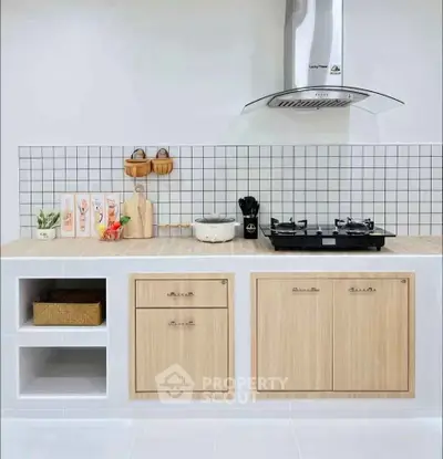 Modern kitchen with gas stove and sleek cabinetry in minimalist design