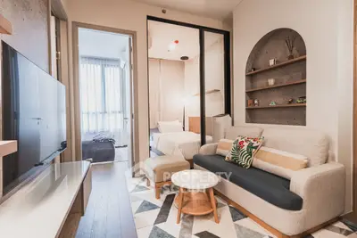 Stylish modern living room with cozy sofa and decorative shelves
