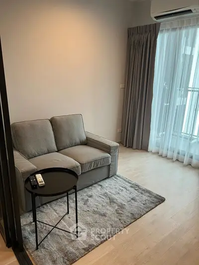 Cozy living room with modern sofa and natural light from large window