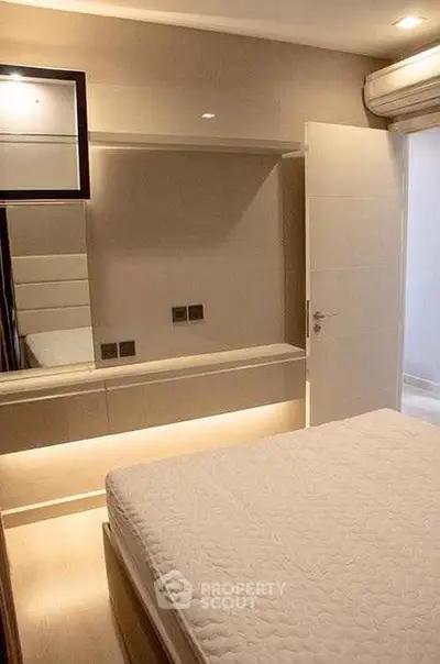 Modern bedroom with sleek design and ambient lighting