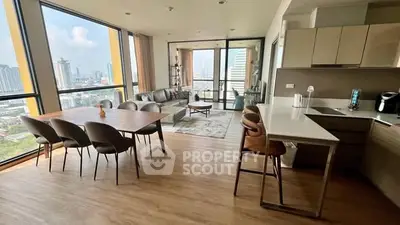 Spacious open-plan living and dining area with stunning city views in modern high-rise apartment.