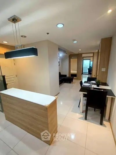 Modern apartment interior with sleek dining area and stylish lighting