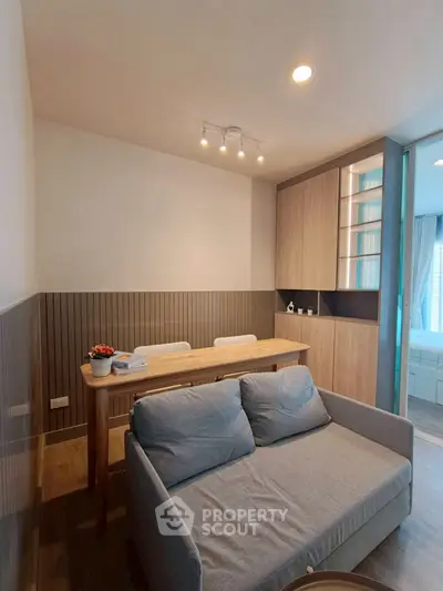 Modern living room with cozy sofa and dining area in stylish apartment