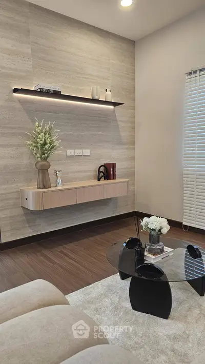 Modern living room with sleek floating shelf and stylish decor