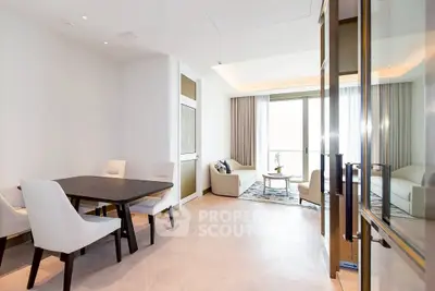 Elegant modern living room with dining area and large windows