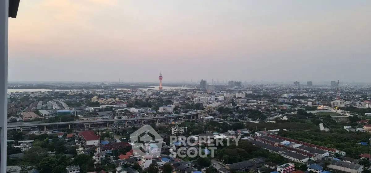 Stunning cityscape view from high-rise apartment balcony at sunset