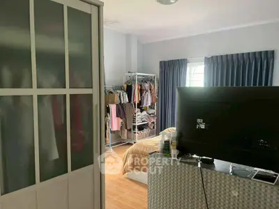 Spacious bedroom with modern decor and ample natural light