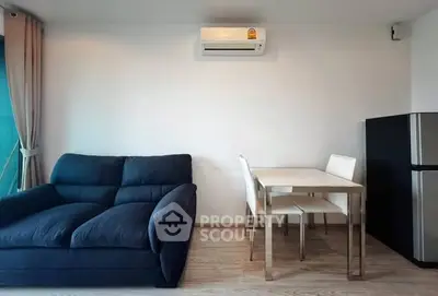 Modern living room with sleek furniture and air conditioning