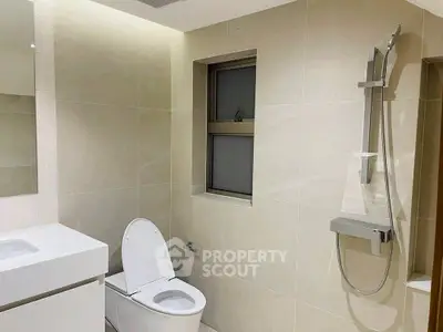 Modern bathroom with sleek fixtures and neutral tones