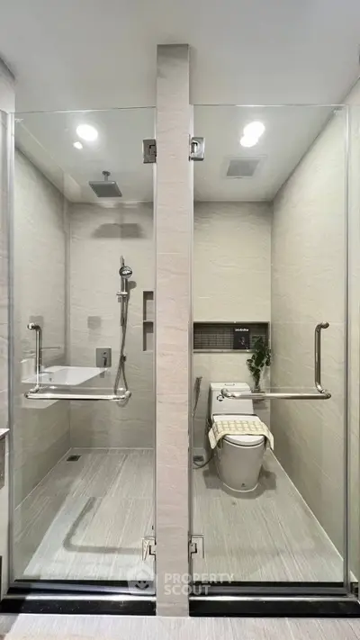 Modern bathroom with glass shower and sleek toilet design