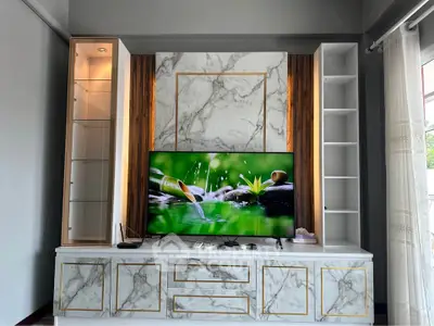 Luxurious living room with elegant marble TV stand and modern decor