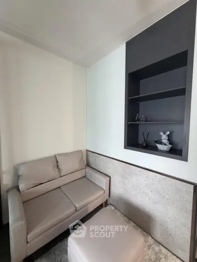 Cozy living room with modern sofa and built-in shelving