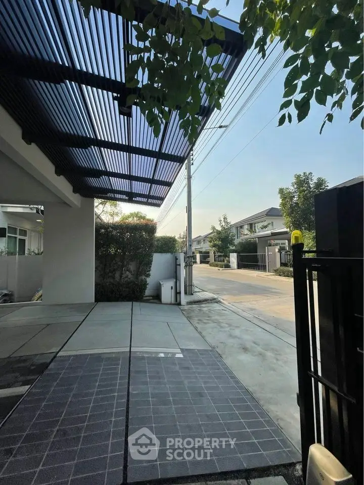 Modern residential driveway with sleek design and street view
