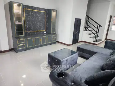 Spacious modern living room with elegant furniture and stylish entertainment center