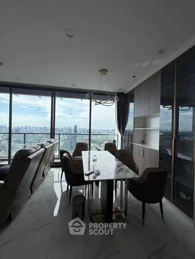 Luxurious high-rise living room with stunning city view and elegant dining area.