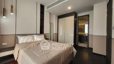 Modern bedroom with elegant design and ensuite bathroom in luxury apartment