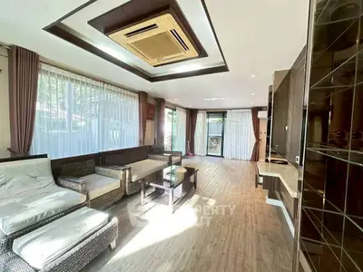 Spacious living room with modern design and large windows for natural light