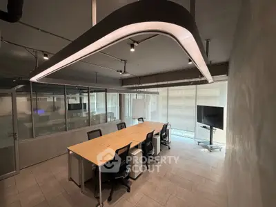 Modern office space with sleek lighting and conference table