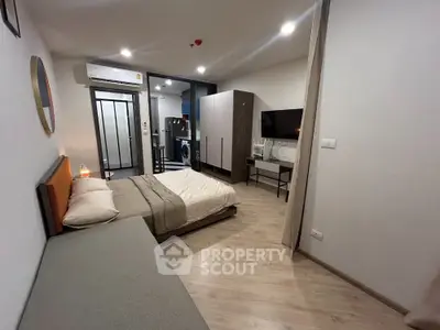 Modern studio apartment with cozy bedroom and stylish decor