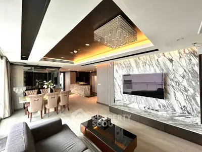 Luxurious modern living room with marble accents and elegant dining area