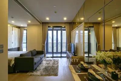 Luxurious modern living room with city view, elegant decor, and spacious layout in high-rise apartment.