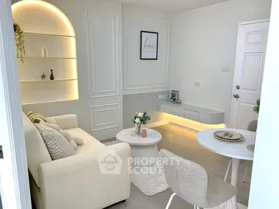 Chic modern living room with cozy seating and elegant decor, perfect for relaxation and entertaining.