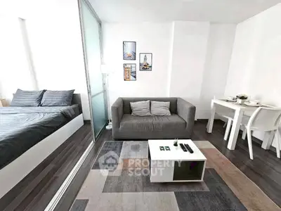 Modern studio apartment with cozy living area and stylish decor